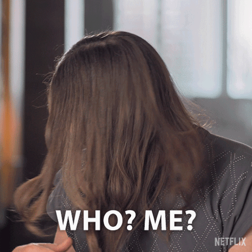 Woman Covering Face With Hair Asking Who Me GIF