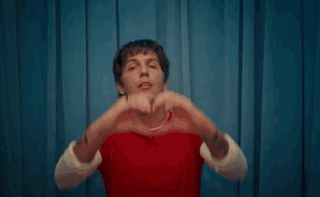 Woman Covering Face With Hands Making Funny Face