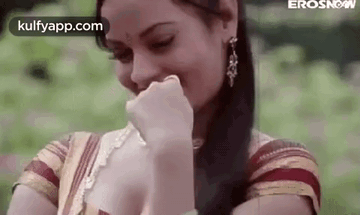 Woman Covering Mouth and Laughing