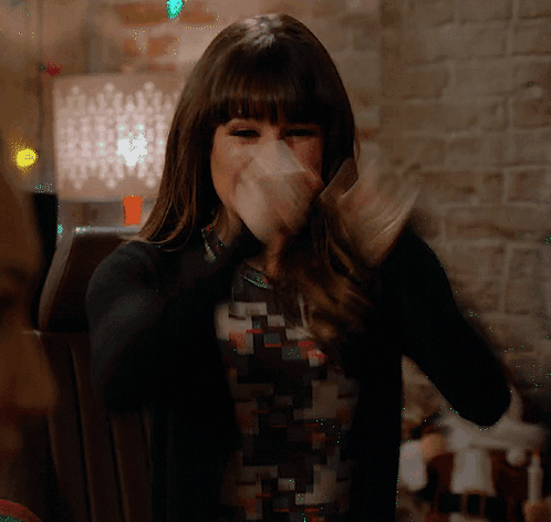 Woman Covering Mouth In Black Sweater GIF