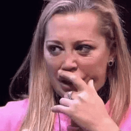 Woman Covering Mouth