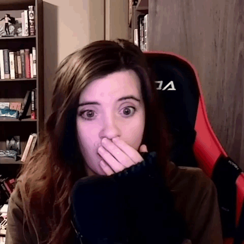 Woman Covering Mouth Sitting In Chair GIF