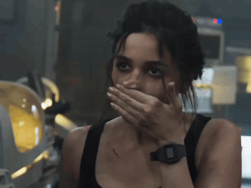 Woman Covering Mouth With Hand Wearing Watch