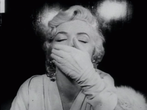Woman Covering Mouth With White Gloves GIF