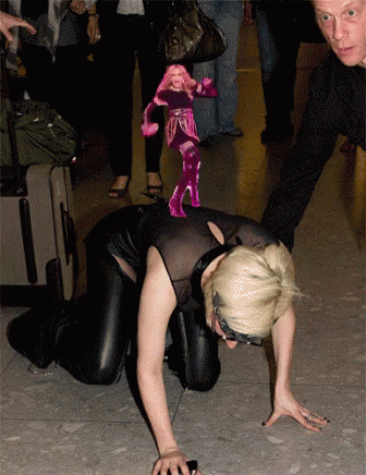 Woman Crawling With Pink Doll On Back