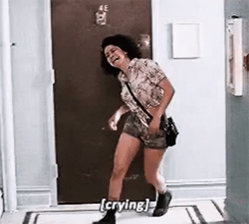 Woman Crying and Laughing in Hallway