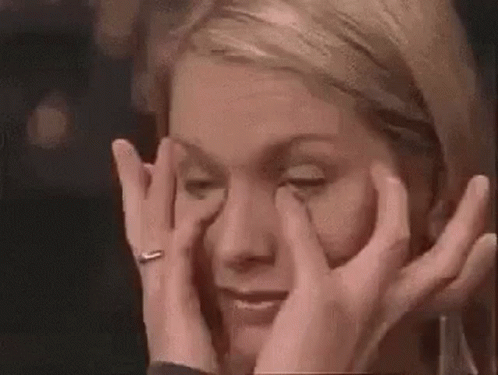 Woman Crying Covering Eyes GIF