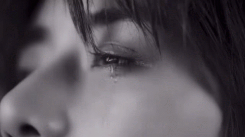 Woman Crying in Black and White Photo with Tear
