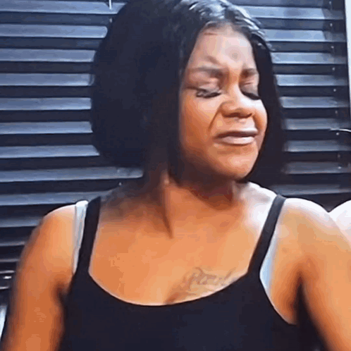 Woman Crying in Black Tank Top