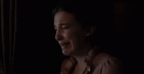 Woman Crying In Dark Room Looking Out Window GIF