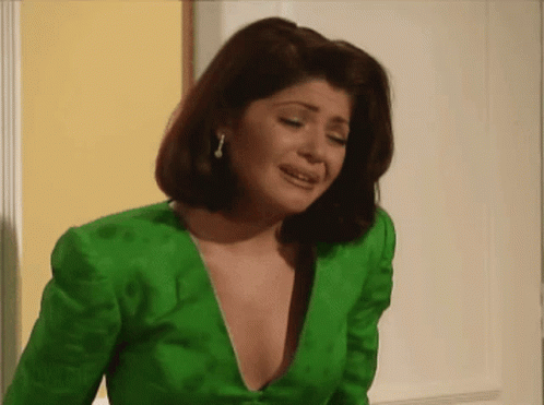 Woman Crying in Spanish Green Shirt and Sweater
