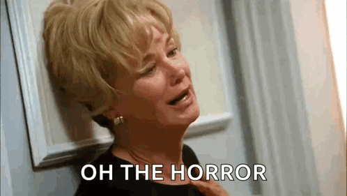 Woman Crying Leaning Against Wall Oh the Horror