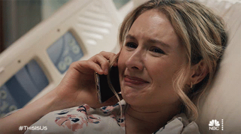 Woman Crying on Phone in Hospital Bed