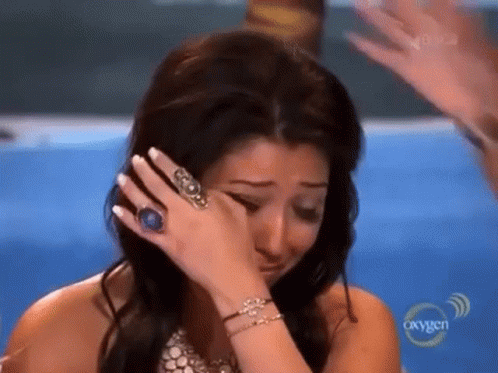 Woman Crying Wearing Ring and Bracelets