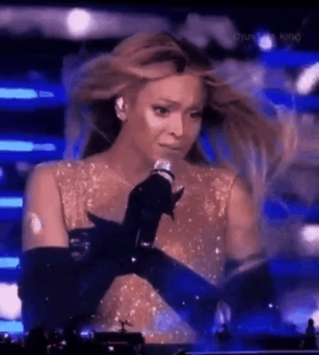 Woman Crying While Singing Into Microphone
