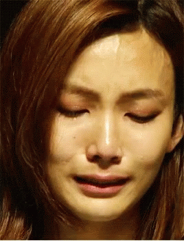 Woman Crying With Eyes Closed and Mouth Open