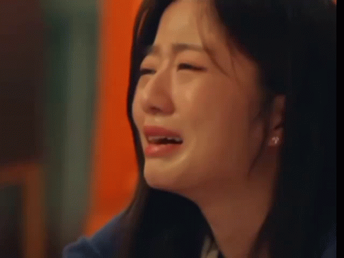 Woman Crying with Eyes Closed and Tears