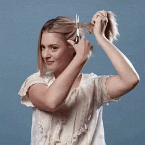 Woman Cutting Hair With Scissors GIF