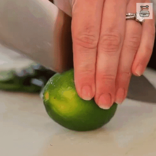 Woman Cutting Lime with Knife