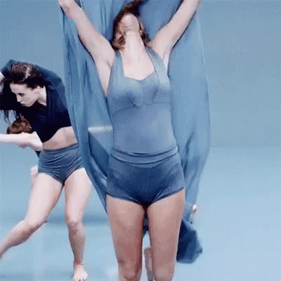 Woman Dancing in Blue Leotard and Shorts