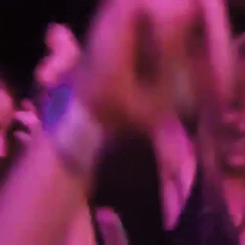 Woman Dancing In Club With Purple Lights GIF