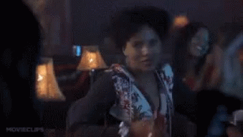 Woman Dancing In Dark Room Holding Drink GIF