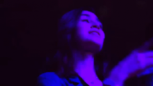 Woman Dancing in Dark Room Livmo Live More