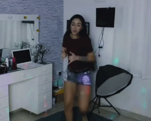 Woman Dancing in Front of Laptop