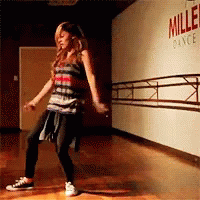 Woman Dancing in Front of Miller Wall