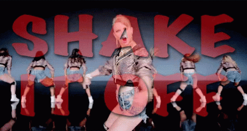 Woman Dancing in Front of Shake It Off Sign