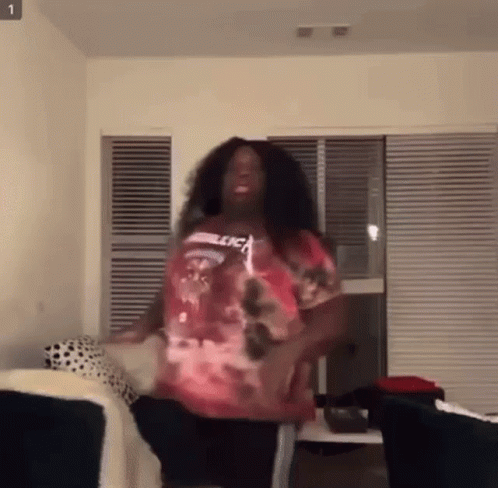 Woman Dancing in Living Room Pink Shirt