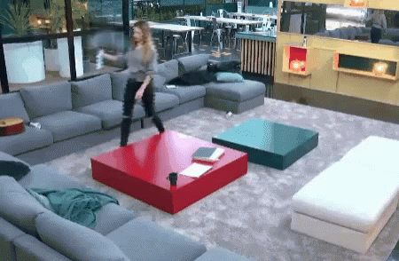 Woman Dancing In Living Room With Red Table GIF