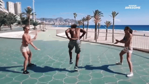 Woman Dancing in Park, Man Holding Drink