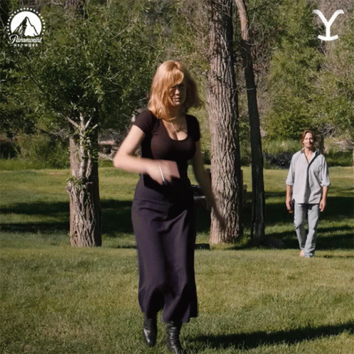 Woman Dancing in Park with Paramount Logo