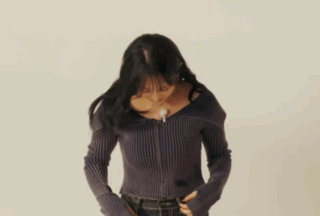 Woman Dancing in Sweater