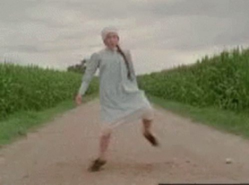 Woman Dancing in White Dress
