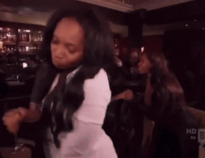 Woman Dancing In White Shirt Near HD Sign GIF