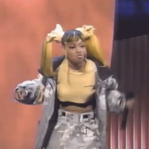Woman Dancing On Stage In Yellow Top And Jacket GIF
