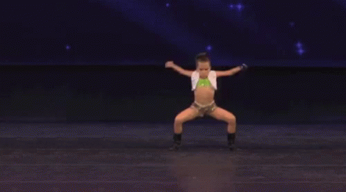 Woman Dancing on Stage Saying Dancing With YT