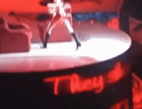 Woman Dancing On Stage With They All Sign GIF