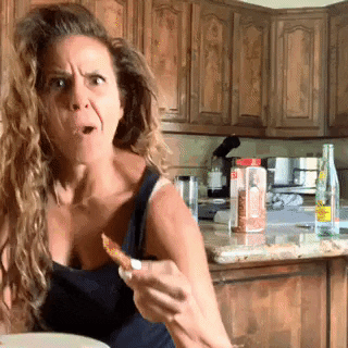 Woman Dancing While Chewing GIF