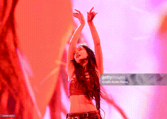 Woman Dancing With Arms In Air GIF