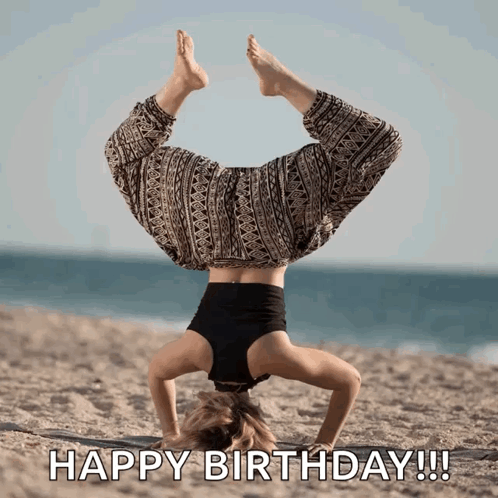 Woman Doing Handstand on Beach Saying Happy Birthday