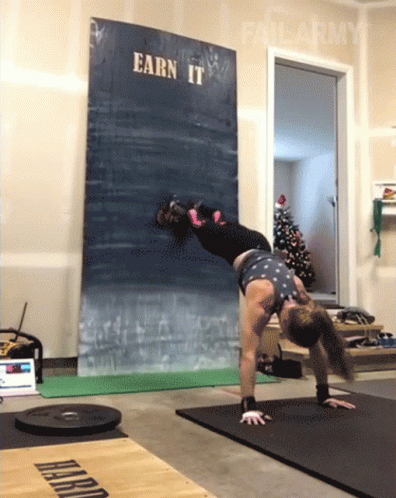 Woman Doing Handstand Sign Saying Earn It