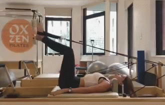 Woman Doing Pilates on Machine