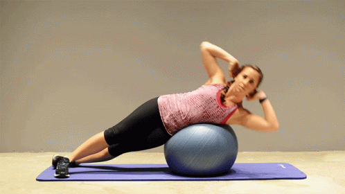Woman Doing Plank on Blue Exercise Ball