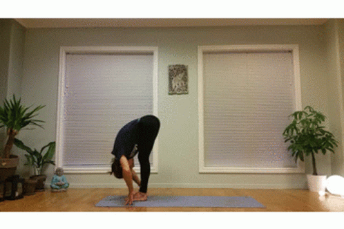 Woman Doing Yoga Pose on Mat
