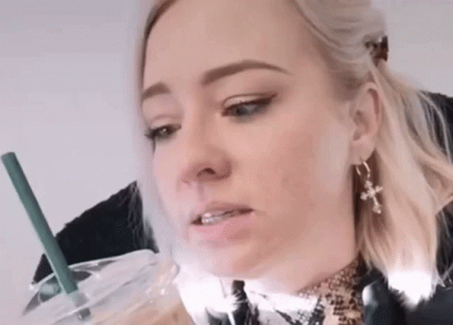 Woman Drinking Beverage With Straw GIF