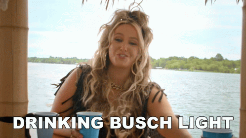 Woman Drinking Busch Light by Water