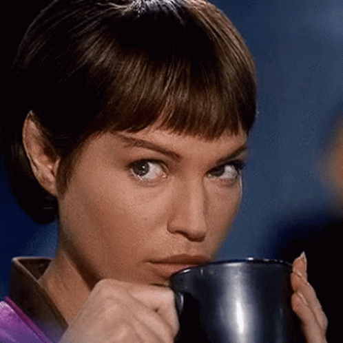 Woman Drinking Coffee From Metal Mug